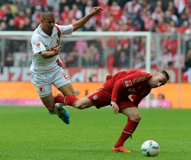 Bayern Munich's French Midfielder Franck Ribery (R) And Augsburg's Cameroon's Midfielder Marcel Ndjeng Vie For The Ball