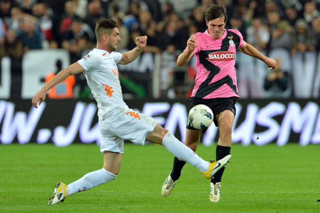 AS Roma's Midfielder Aleandro Rosi (L) Challanges