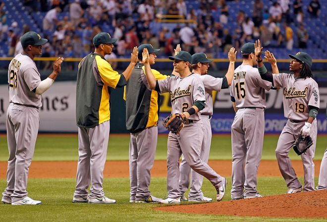   The Oakland Athletics Celebrate Their Victory Over The Tampa Bay Rays At Tropicana Field On May 5, 2012 In St.