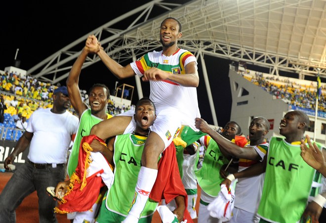 Mali's Seydou Keita (Top C) And Teammates