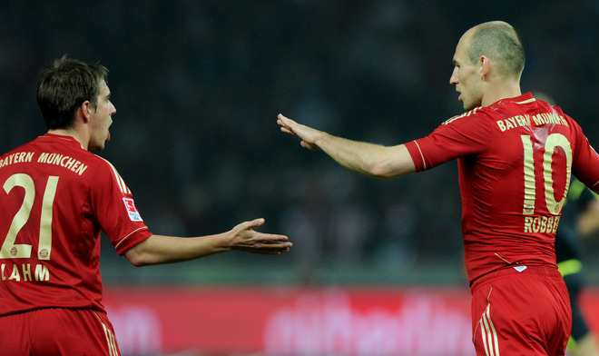 Bayern Munich's Dutch Midfielder Arjen Robben (R) Celebrates With His Teammate Bayern Munich's Defender Philipp Lahm 