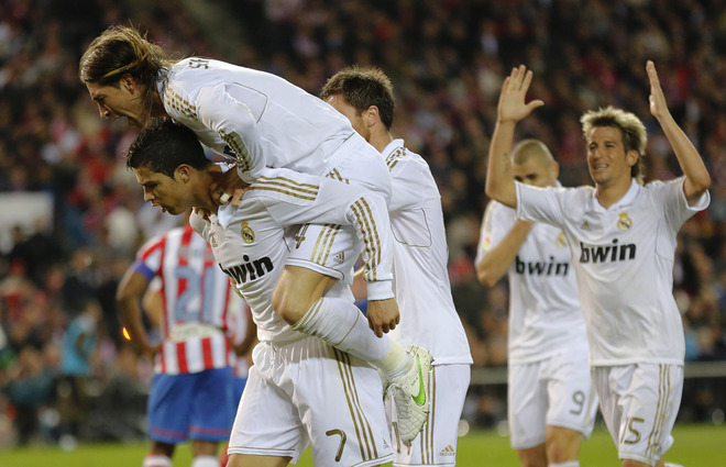 Real Madrid's Portuguese Forward Cristiano Ronaldo (L) Celebrates