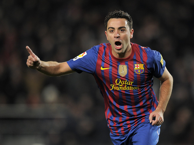 Barcelona's Midfielder Xavi Hernandez Celebrates