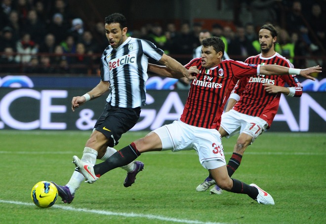 Juventus Forward Fabio Quaglierella (L) Fights For The Ball With AC Milan's Brazilian Defender Thiago Silva On February