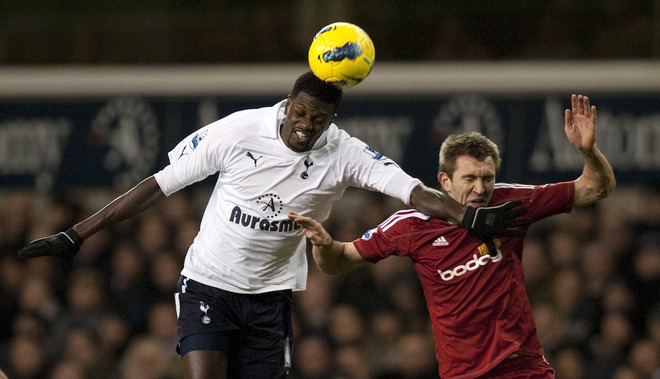 Tottenham Hotspurs' Emmanuel Adebayor (L) Vies For The Ball Against West Bromwich Albion's Gareth McAuley (R) 