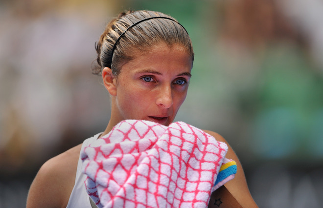 Sara Errani of Italy towels off while playing against Petro Kvitova of the