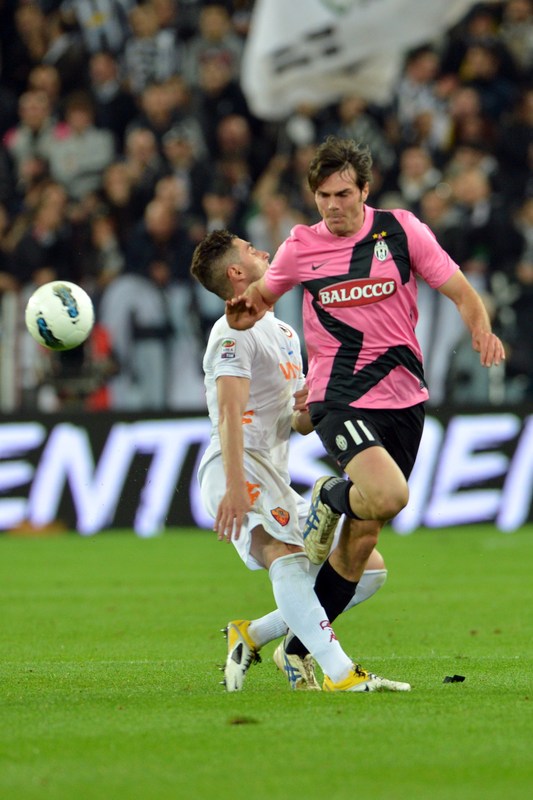 AS Roma's Midfielder Aleandro Rosi  (L) Vies