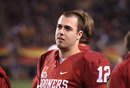 TEMPE, AZ - DECEMBER 30:  Quarterback Landry Jones #12 of the Oklahoma Sooners watches from the sidelines during the Insight Bowl against the Iowa Hawkeyes at Sun Devil Stadium on December 30, 2011 in Tempe, Arizona. The Sooners defeated the Hawkeyes 31-14.  (Photo by Christian Petersen/Getty Images)