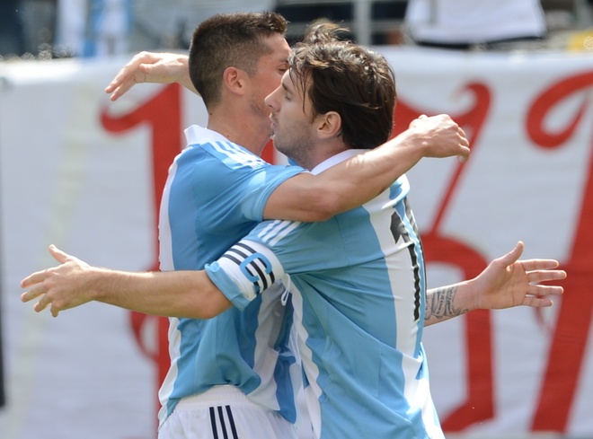 Argentine Player Lionel Messi (R) Celebrates