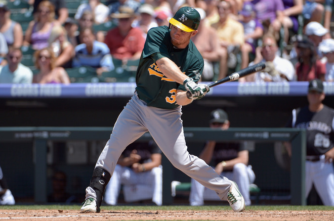   Brandon Moss #37 Of The Oakland Athletics Hits A Two RBI Triple Off Of Starting Pitcher Alex White #6 Of The Colorado