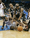 OKLAHOMA CITY, OK - DECEMBER 25:  Kevin Durant #35 of the Oklahoma City Thunder and Jameer Nelson #14 and Quentin Richardson #5 of the Orlando Magic scramble for a loose ball during the NBA season opening game December 25, 2011 at the Chesapeake Energy Arena in Oklahoma City, Oklahoma.  Oklahoma City defeated Orlando 97-89. NOTE TO USER: User expressly acknowledges and agrees that, by downloading and or using this Photograph, user is consenting to the terms and conditions of the Getty Images License Agreement.  (Photo by Brett Deering/Getty Images)