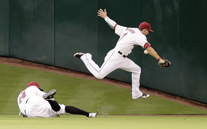 HOUSTON MAY 19 Jordan Schafer 1 of the Houston Astros leaps over Justin 