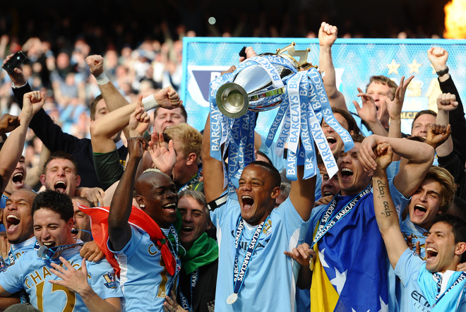 Manchester City's Belgian Captain Vincent Kompany Lifts The Premier League Trophy 

RESTRICTED TO EDITORIAL USE. No Use