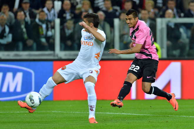 Juventus' Chilean Midfielder Arturo Vidal (R) Kicks