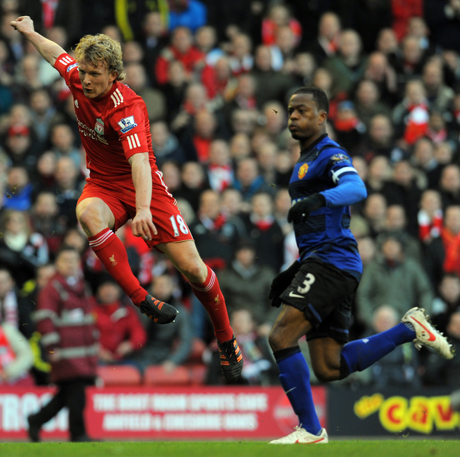 Liverpool's Dutch Striker Dirk Kuyt (L) Scores Their Winning Goal Watched By Manchester United's French Defender