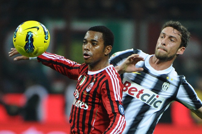 AC Milan's Brazilian Forward Robinho (L) Fights For The Ball With Juventus Midfielder Claudio Marchisio On February 25,