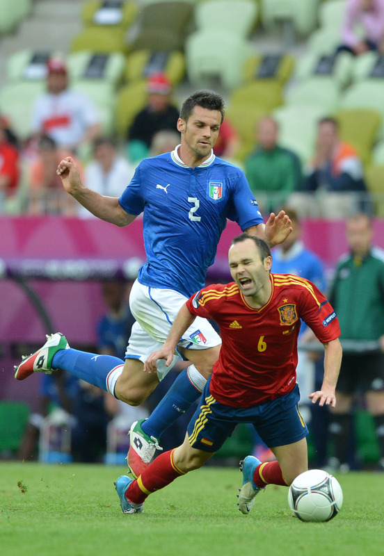 Spanish Midfielder Andres Iniesta (R) Vies