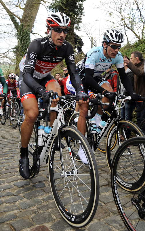 Switzerland's Fabian Cancellara (L) Of Team Radioshack Nissan Trek Rides