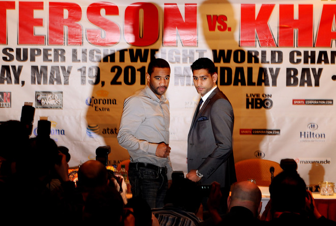   Amir Khan (R) And Lamont Peterson