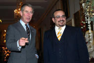In this photo dated Dec. 9, 2004 Prince Charles, left, greets the Crown Prince of Bahrain, Salman bin Hamad Al Khalifa at St. James Palace, London. The full list of confirmed guests and the seating plan for the royal wedding of Prince William and Kate Middleton were released by the British monarchy Saturday April 23, 2011. St. James's Palace also confirmed for the first time that Bahrain's Crown Prince Salman bin Hamad Al Khalifa will be attending, despite British concerns about the treatment of activists there. Bahrain's royal family ordered a wide-ranging brutal crackdown against pro-democracy demonstrators that started in mid-February. At least 30 people have died, including four in custody, and many well-known activists and lawyers have been imprisoned.  (AP Photo/PA Wire)UNITED KINGDOM OUT