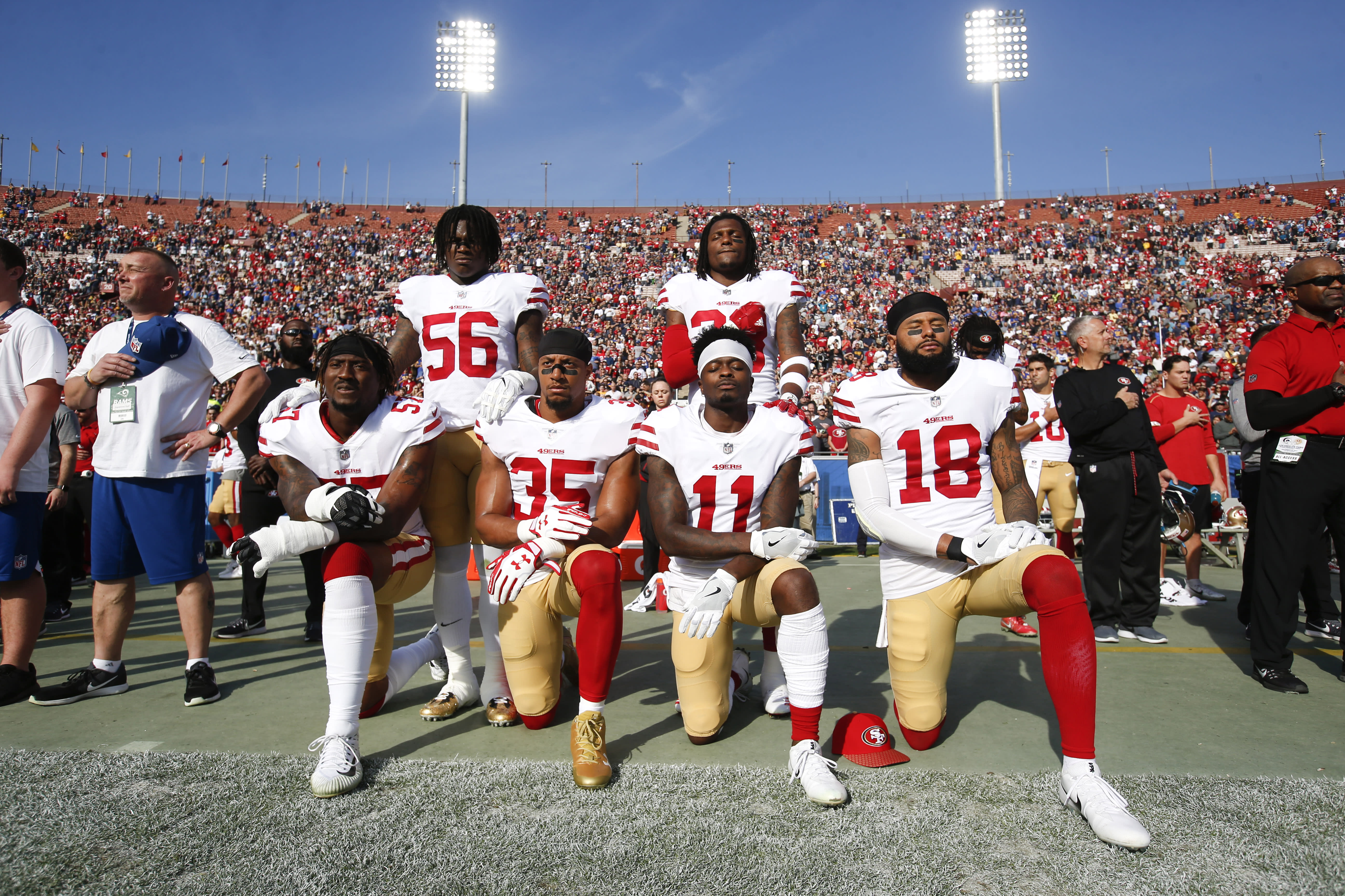 NFL owners approve new policy on kneeling