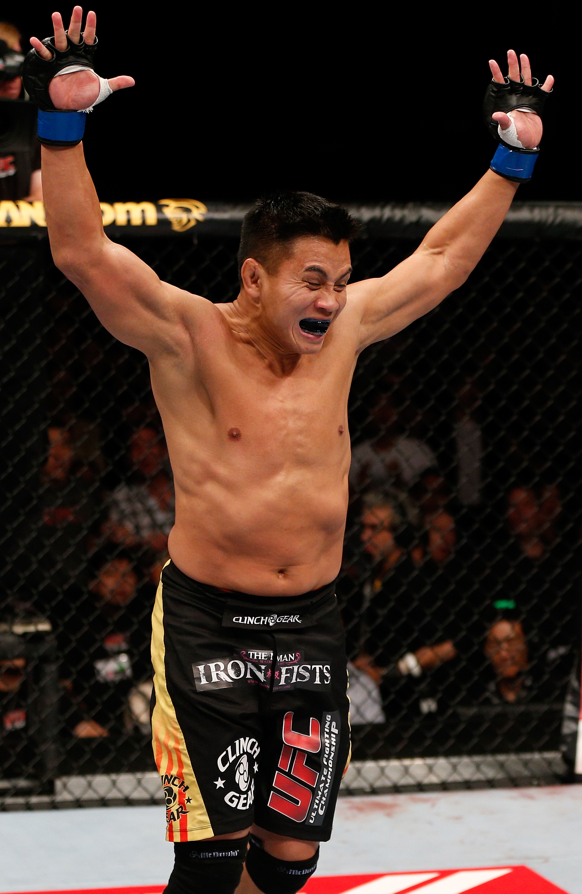 Cung Le celebrates after beating Rich Franklin in 2012. (Getty)