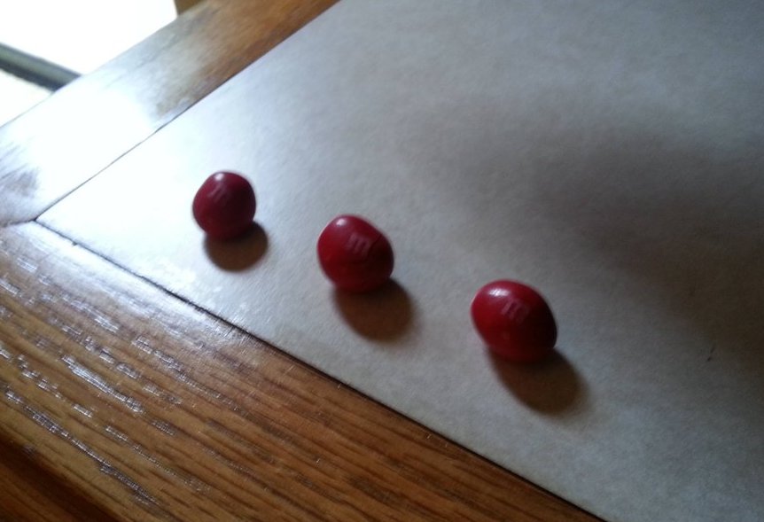 a group of red candies on a table