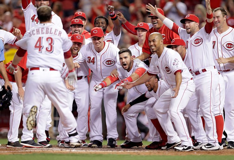 CINCINNATI, OH - AUGUST 02: Scott Schebler #43 of the Cincinnati Reds runs to home plate as his teammates celebrate after hitting a three run home run in the ninth inning to beat the St. Louis Cardinals 7-5 at Great American Ball Park on August 2, 2016 in Cincinnati, Ohio. (Photo by Andy Lyons/Getty Images)