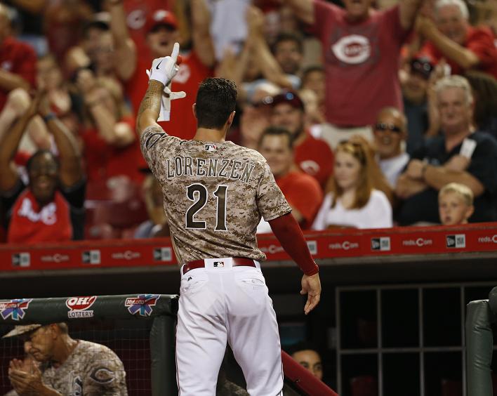 Michael Lorenzen acknowledges the fans at Great American Ballpark after his emotional first career home run. (AP)