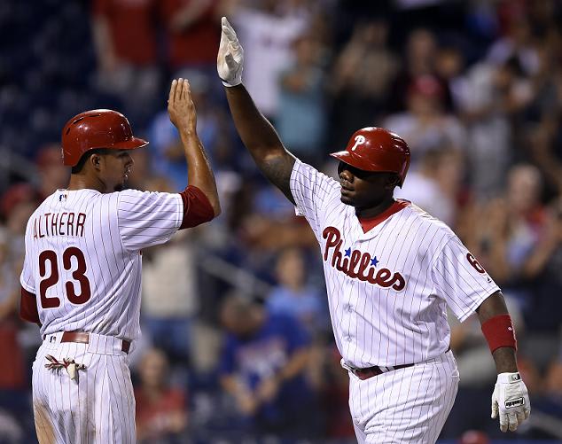 Ryan Howard of the Phillies celebrates his 14th career grand slam. (AP)