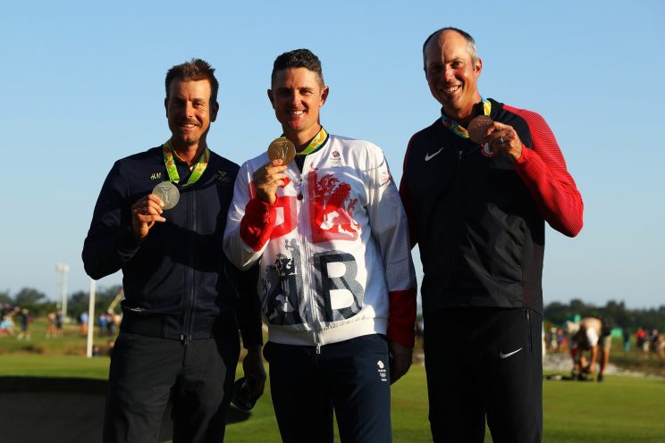 The Olympic golf medalists show off their medals. (Getty Images)