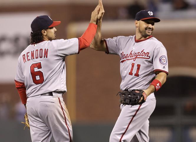 Anthony Rendon (left) and Ryan Zimmerman (right) combined for a historic triple play. (AP)