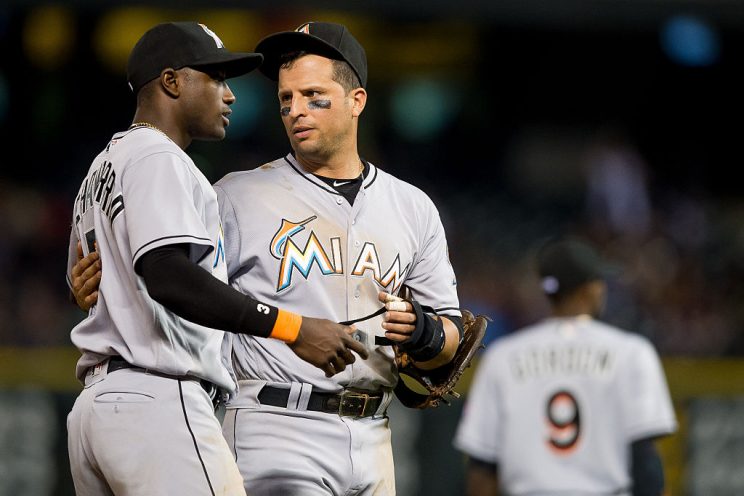 DENVER, CO - AUGUST 5: Adeiny Hechavarria #3 and Martin Prado #14 of the Miami Marlins celebrate after going ahead in the middle of the ninth inning of a game against the Colorado Rockies at Coors Field on August 5, 2016 in Denver, Colorado. (Photo by Dustin Bradford/Getty Images)