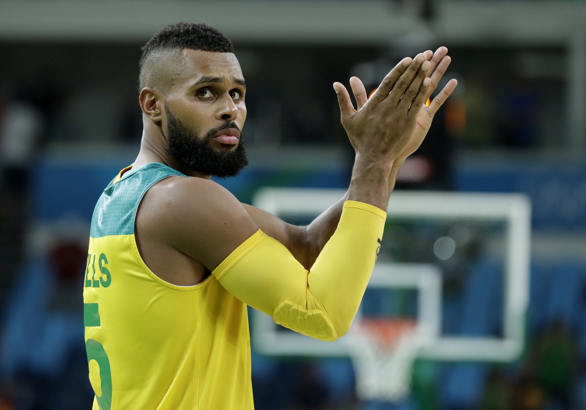 Patty Mills and the rest of the Australian men's national basketball team earned a round of applause with another stellar effort to beat Lithuania. (AP/Charlie Neibergall)