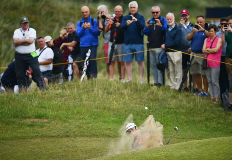 Bunkers at Birkdale, like this one hiding Jon Rahm, are wicked things. (Getty)