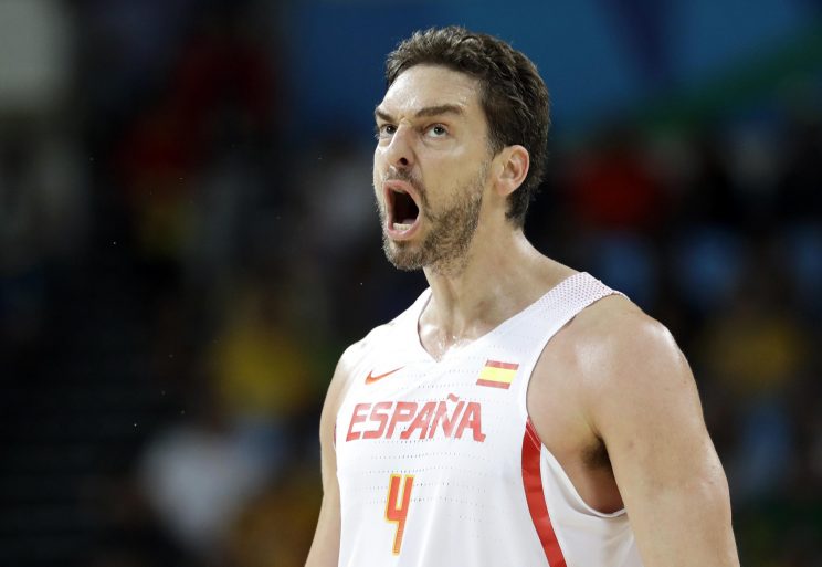 Spain's Pau Gasol (4) reacts after making a basket during a basketball game against Lithuania at the 2016 Summer Olympics in Rio de Janeiro, Brazil, Saturday, Aug. 13, 2016. (AP Photo/Charlie Neibergall)