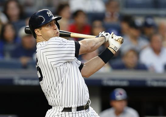 Mark Teixeira delivers a three-run home run to give the Yankees the lead. (AP)