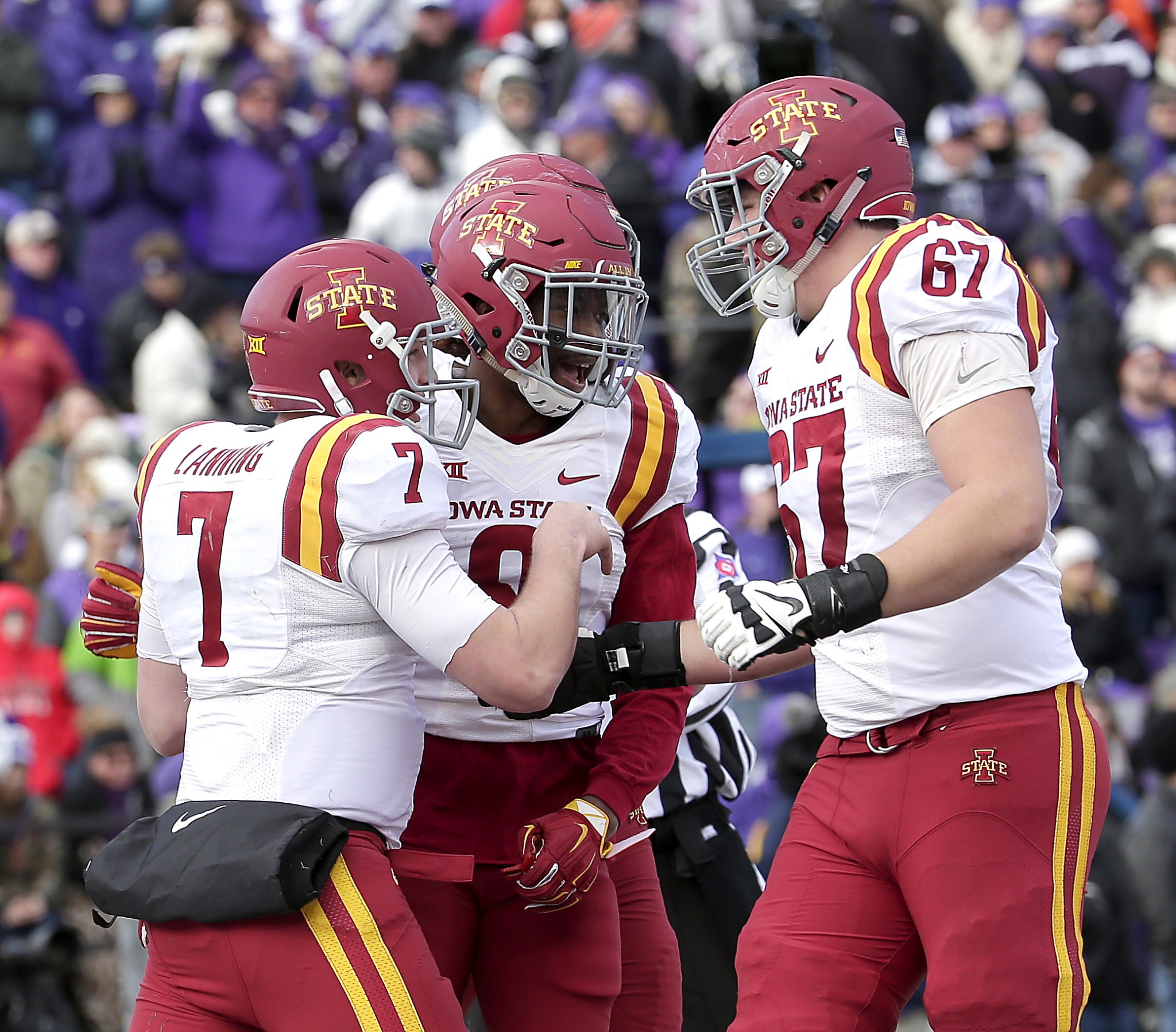 Iowa State QB Joel Lanning (7) celebrates with wide receiver Quenton Bundrage, center, and offensive lineman Jake Campos (67). (AP Photo/Charlie Riedel)