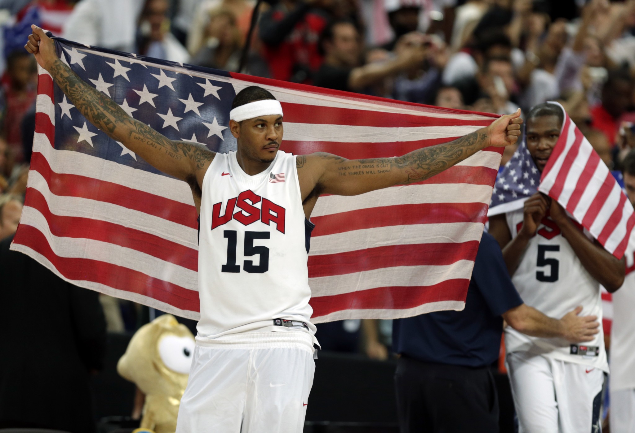 Carmelo Anthony of the United States celebrates after the men's gold medal basketball game at the 2012 Summer Olympics. (AP/Charles Krupa, File)