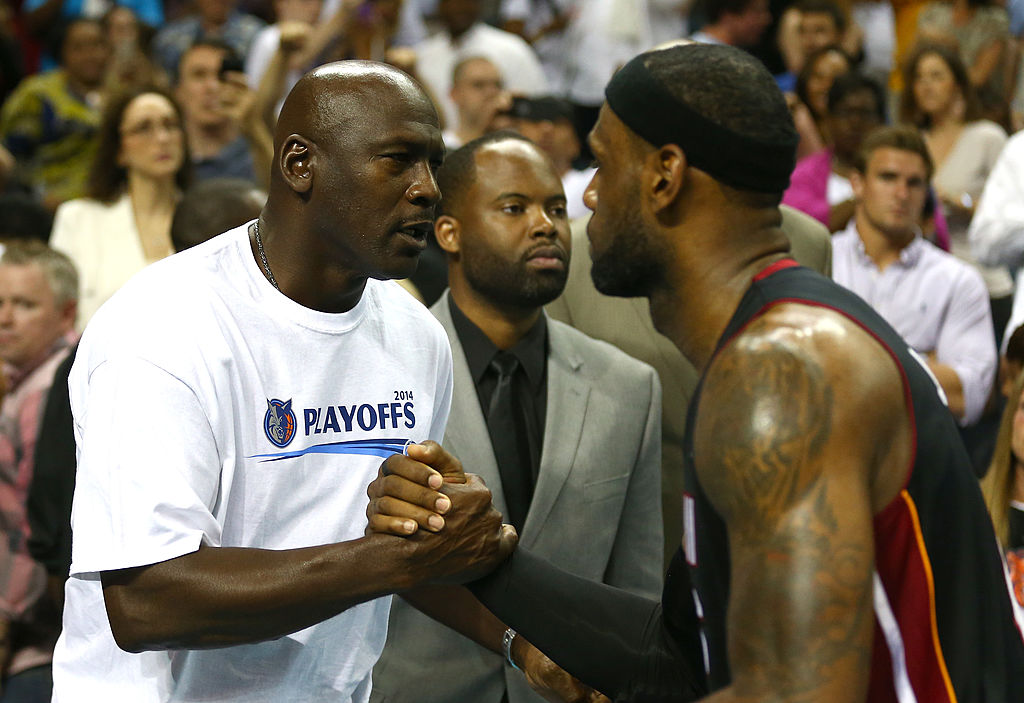 LeBron James hugs Michael Jordan after the Miami Heat defeat the Charlotte Bobcats in Game 4 of the 2014 Eastern Conference Quarterfinals. (Streeter Lecka/Getty Images)