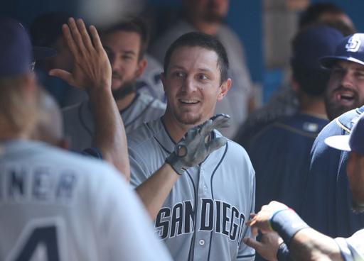 Alex Dickerson of the Padres celebrates his home run in Wednesday's 8-4 win in Toronto. (Getty Images)