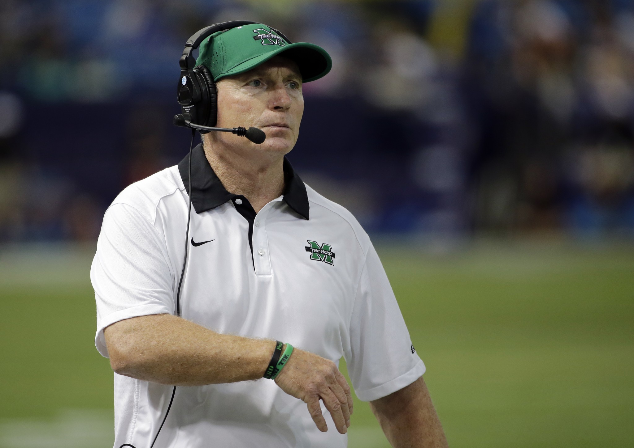 Marshall head coach Doc Holliday watches his team against Connecticut during the second half of the St. Petersburg Bowl NCAA college football game Saturday, Dec. 26, 2015, in St. Petersburg, Fla. (AP Photo/Chris O'Meara)