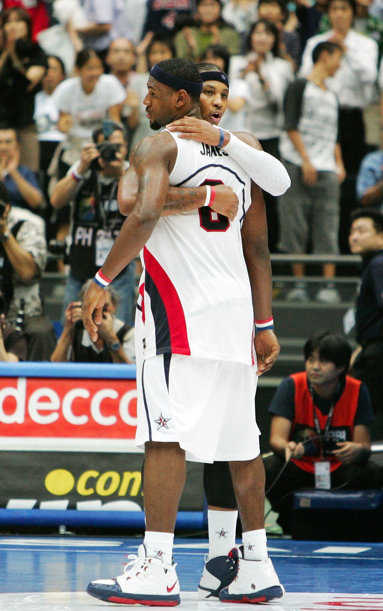 Carmelo Anthony hugs Team USA teammate LeBron James in 2006. (AP/Mark J. Terrill)