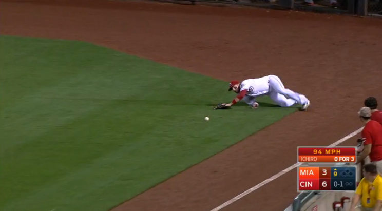 Tyler Holt slides past Ichiro Suzuki's triple.