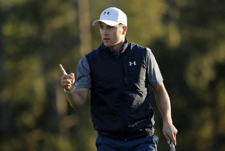 Jordan Spieth waves to the crowd after carding a birdie on 18. (REUTERS)