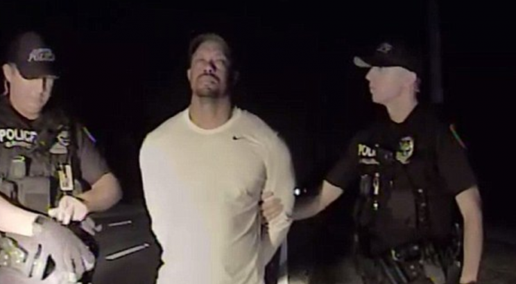 Tiger Woods is shown handcuffed in police dash cam video released Wednesday. (Jupiter PD)