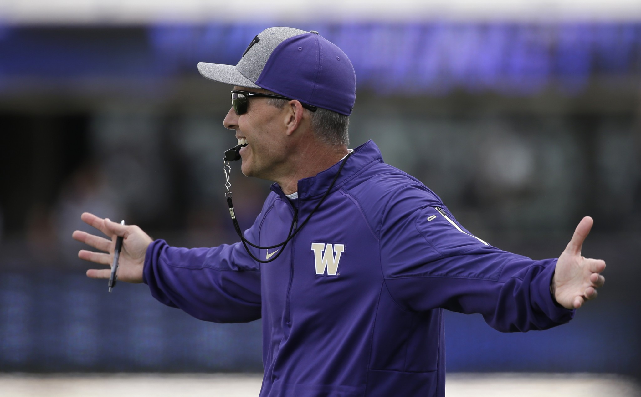 Washington head coach Chris Petersen in action at the team's annual spring preview football event Saturday, April 23, 2016, in Seattle. (AP Photo/Elaine Thompson)