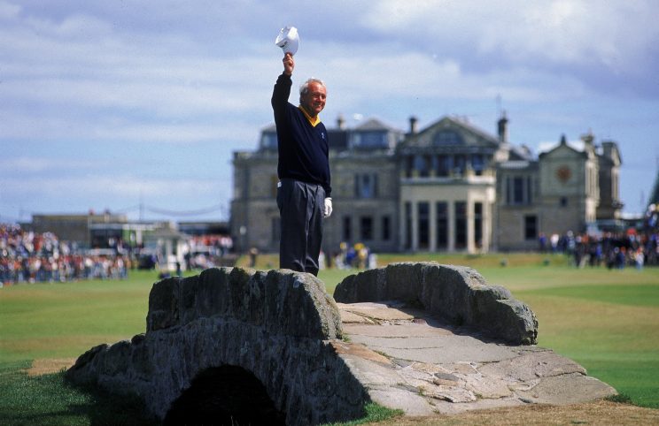 Arnold Palmer of the USA waves to the crowd from the Swilken Bridge on the 18th hole during the second round of the British Open at St Andrews in Scotland. This proved to be a farewell from Palmer as shortly after the round he announced this would be his last British Open appearance.
