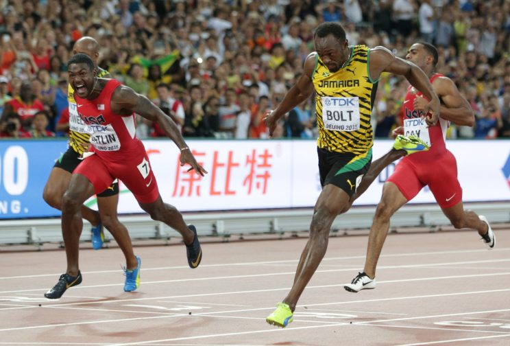 Jamaica's Usain Bolt, right, wins the gold medal in the men's 100m ahead of United States' Justin Gatlin, left, at the World Athletics Championships at the Bird's Nest stadium in Beijing, Sunday, Aug. 23, 2015. (AP Photo/Lee Jin-man)