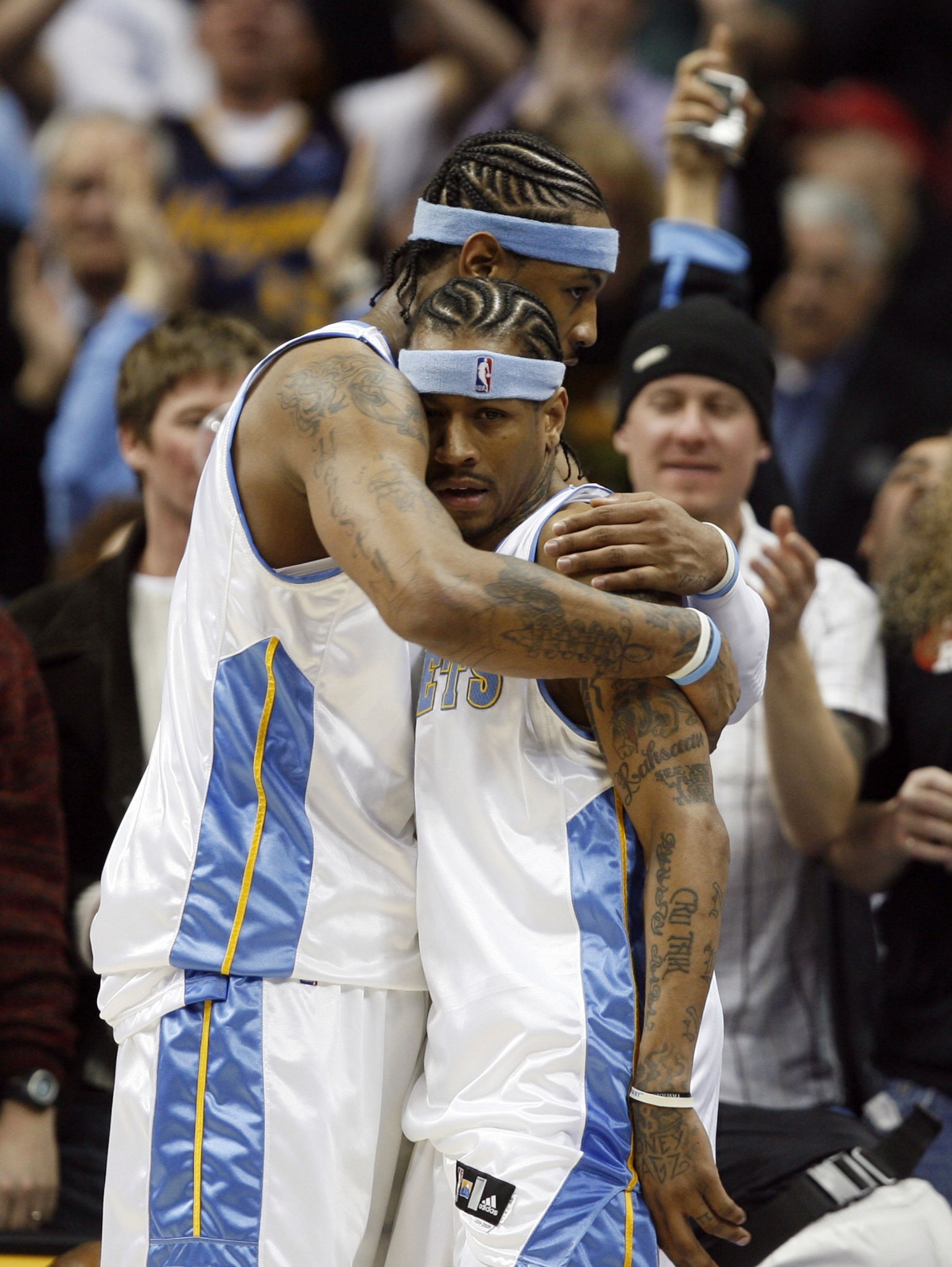 Carmelo Anthony lets Allen Iverson know how much he appreciates him in 2007. (AP/David Zalubowski)